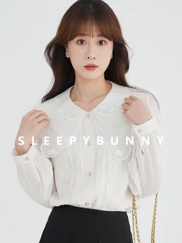 Сладката бяла дамска риза с яка кукла, лятна удобна корейската мода, висококачествени плочи с джобове, градинска облекло